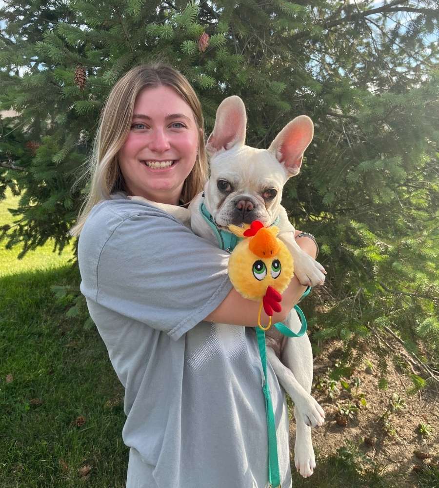 Woman holding French bulldog